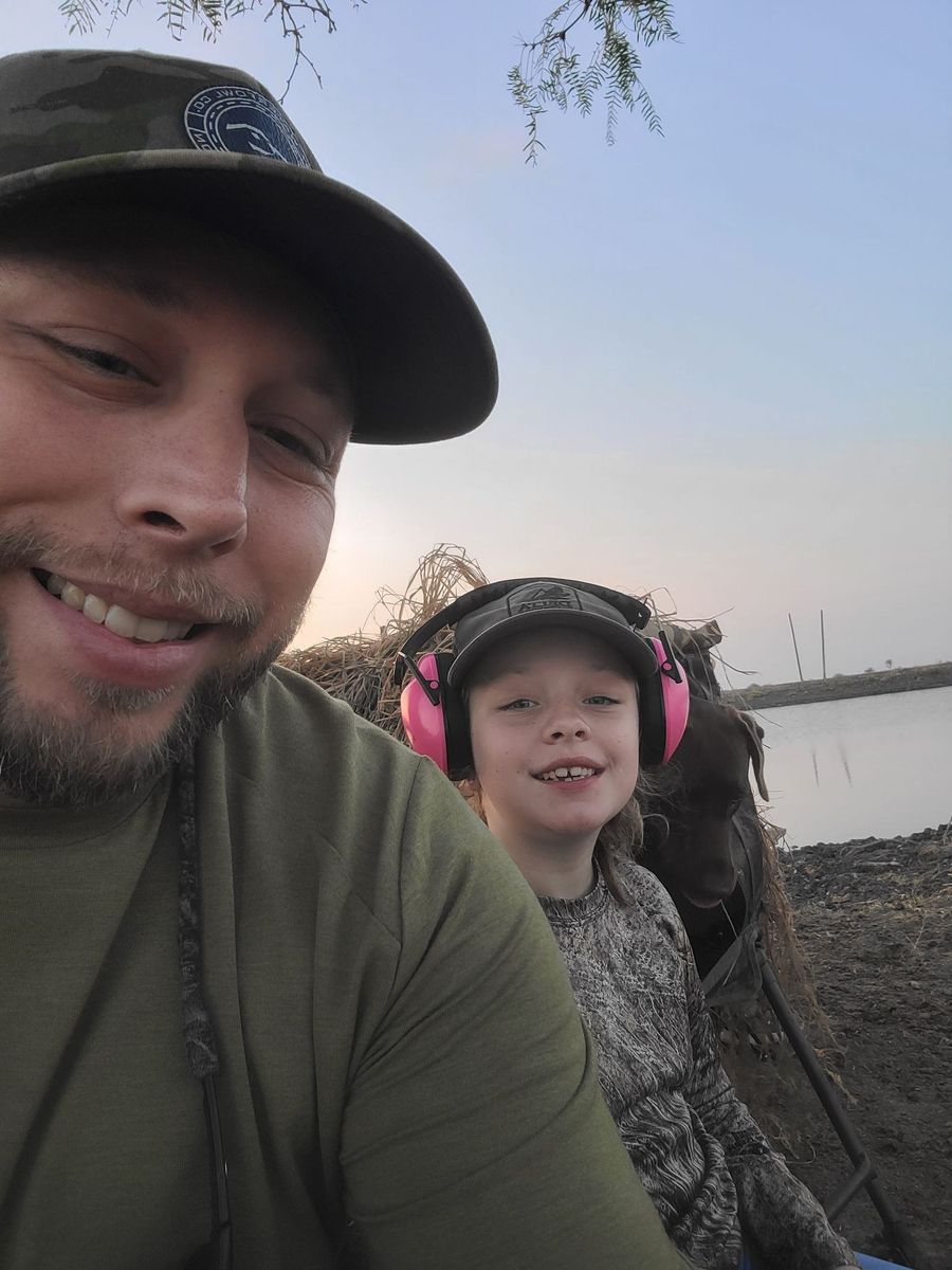 A young hunter in the field with the guide